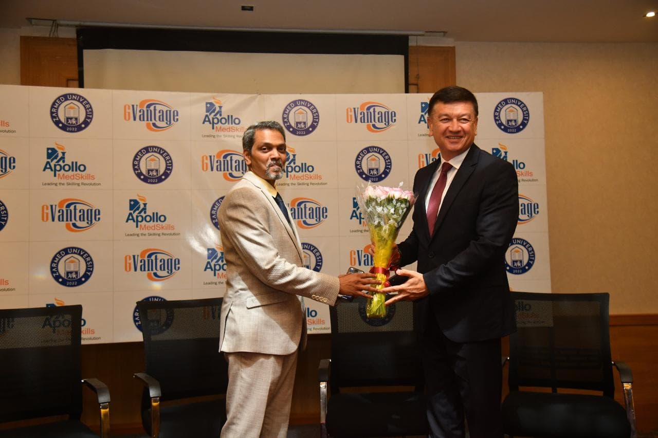 Ceremonial flower exchange at the Hyderabad partnership event